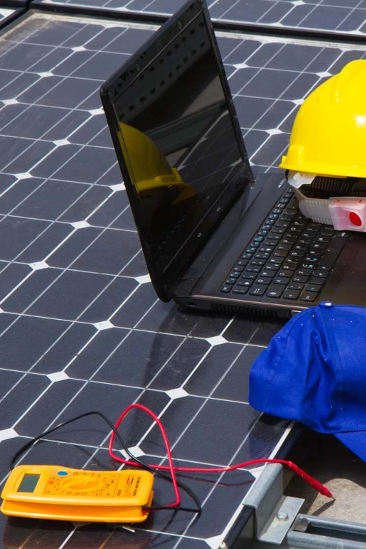 Technician diagnosing the efficiency of a solar power system